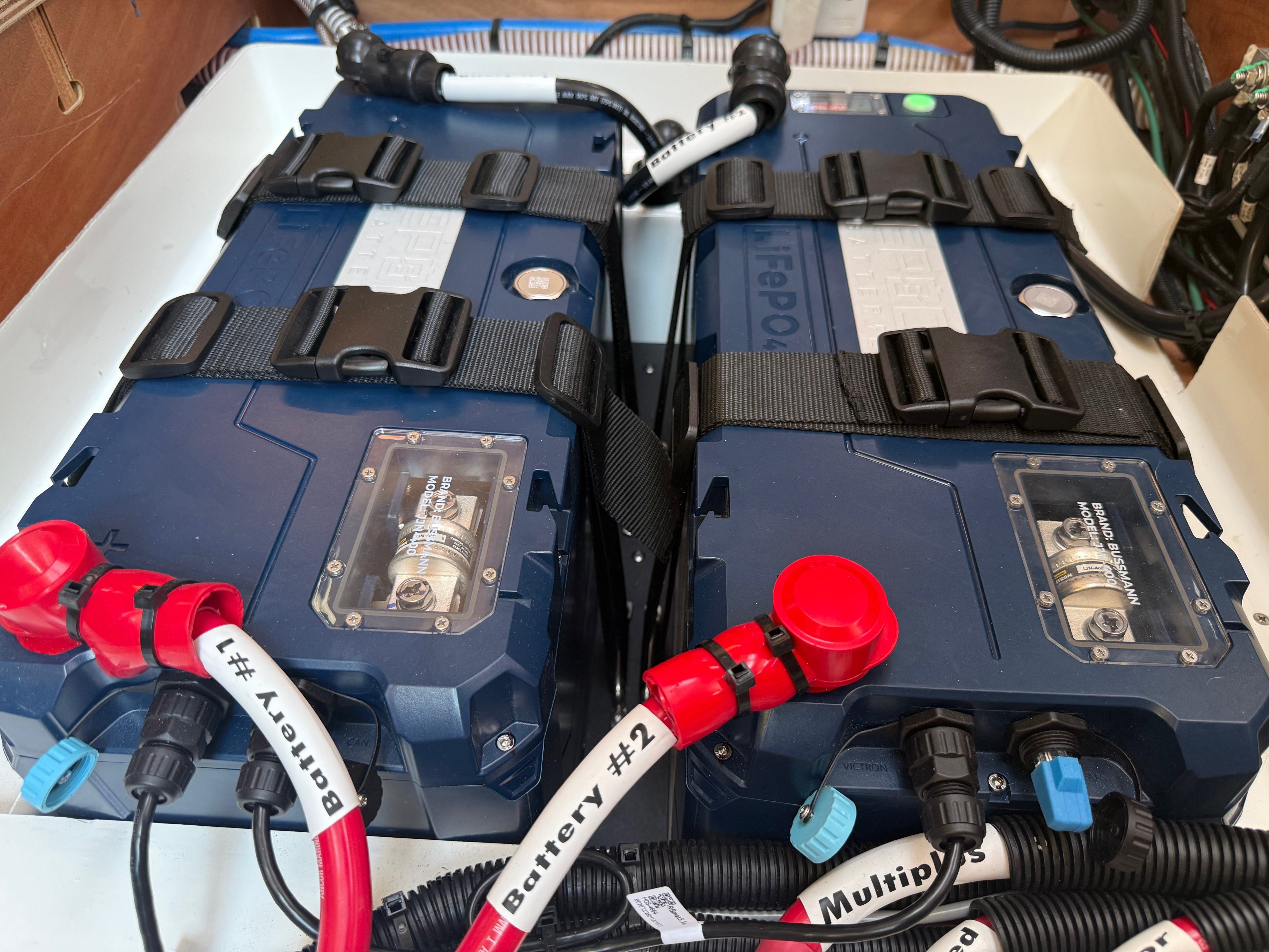 Four Epoch V2-T Elite Series 460Ah LiFePO4 marine batteries installed in parallel as a 1,840 Ah house bank on a Chesapeake cruising catamaran by Marine Electric Systems