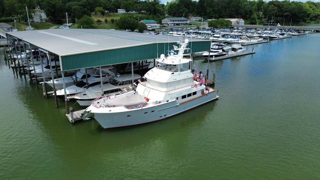 Nordhavn 76 motor yacht Trixie docked at a Chesapeake Bay marina before a Victron MultiPlus-II inverter/charger and Cerbo GX monitoring upgrade by Marine Electric Systems